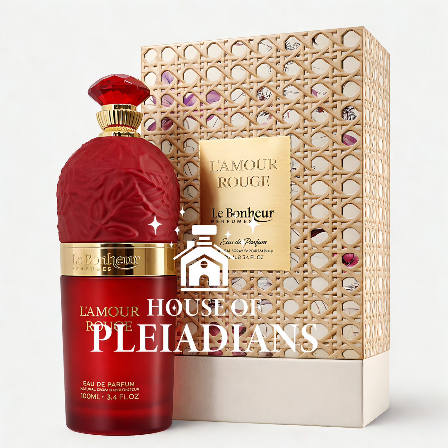 Red perfume bottle with gold accents and decorative box on a white background