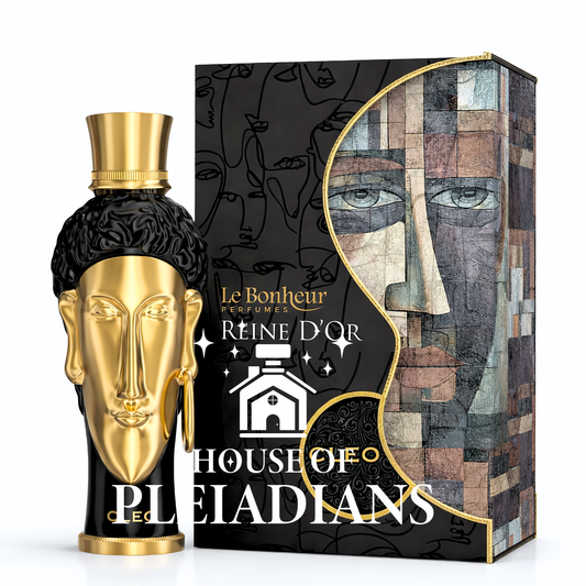 Perfume bottle with gold and black design next to its packaging on a white background